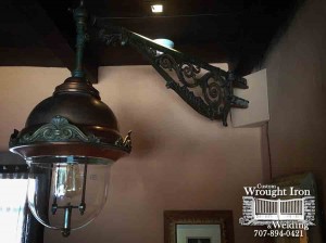 A hand forged light by wine country ironworks.