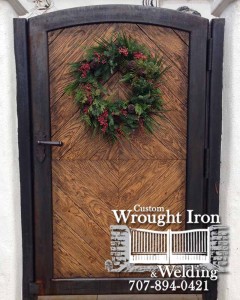 A decorated White Oak Door in Wine Country with an iron frame. 